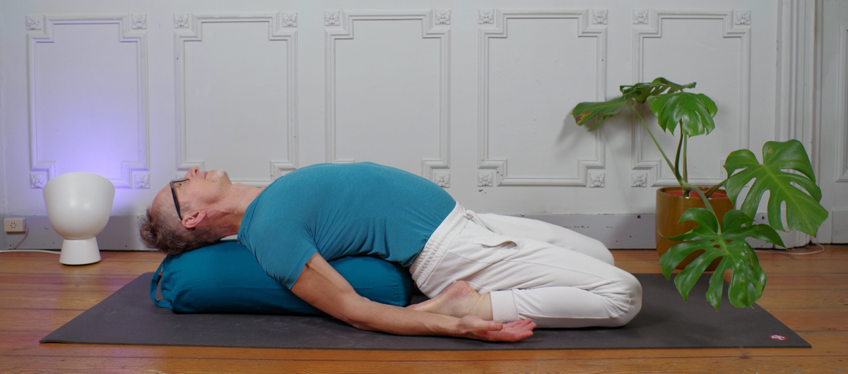The chest-opening reclined Hero Pose from the Deep Stretch Yin Yoga