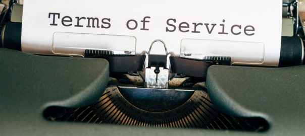 Image d'une machine à écrire qui mentionne : Terms of Service